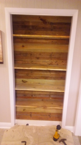 finished closet remodel with pallet siding and shelves