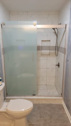 new custom tile shower and floor with built in shelves bench and fixtures