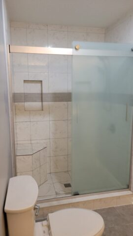 custom tile shower bench accent tile built in shelf frosted glass shower door