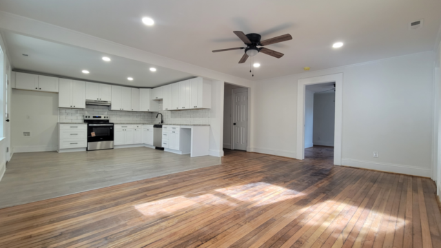 interior kitchen and living room white walls and ceiling bright inside area white cabinets
