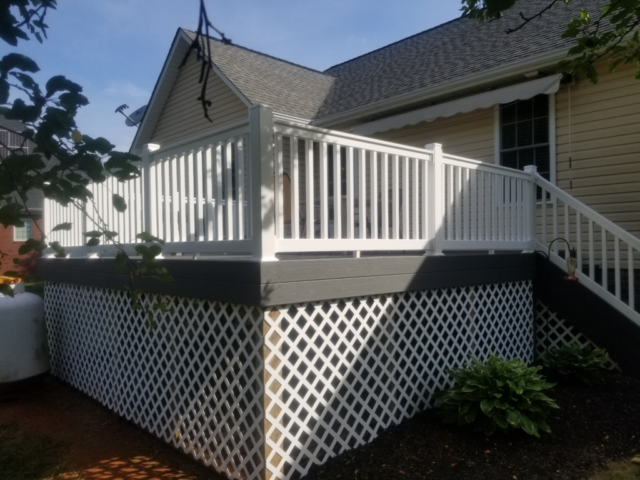 TREX gray deck with white PVC plastic handrails newly installed