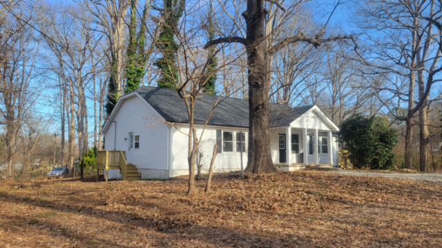 white siding on house with black shutters complete final install full exterior