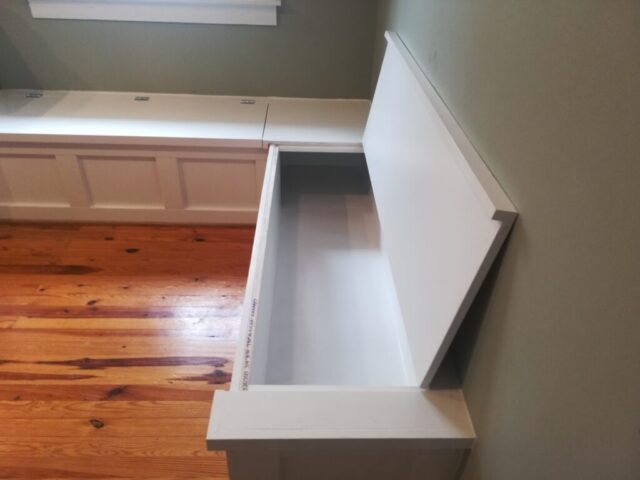 custom white dining room bench with storage open lid