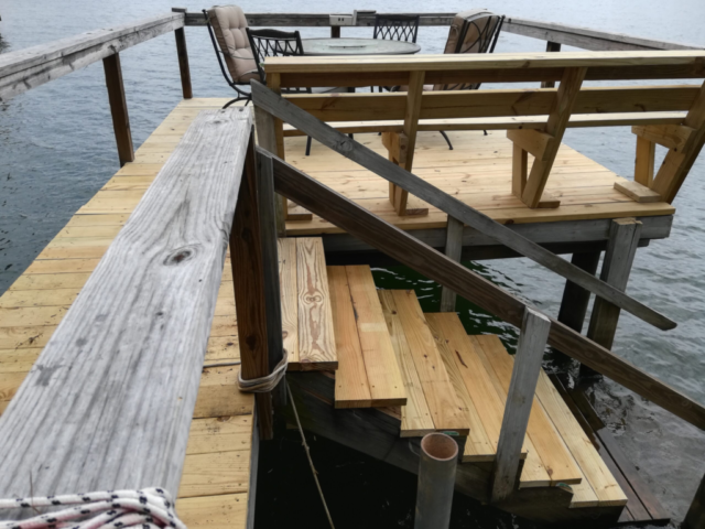 new lake dock flooring installed treated wood
