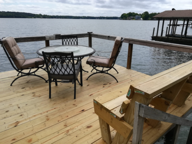 lake view of new finished dock including bench of wood