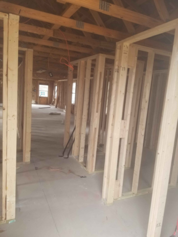 new framing inside house walls and roof trusses exposed new construction framing